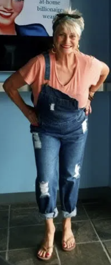 Full-body photo of a confident woman after addiction recovery and long-term sobriety