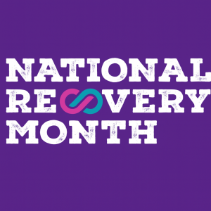 Bold purple banner with distressed white text reading “National Recovery Month” and an interlocking magenta and teal infinity symbol representing the ongoing journey of recovery.