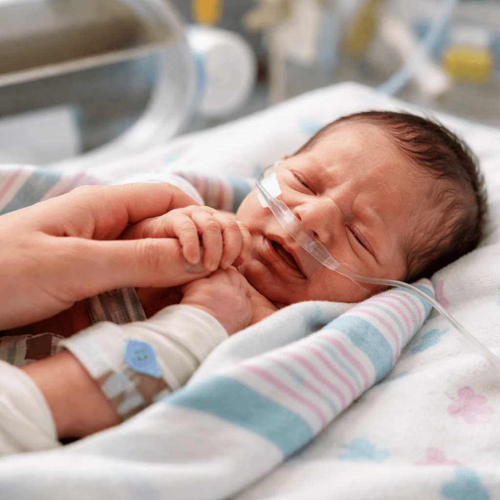 Newborn experiencing neonatal abstinence syndrome symptoms while receiving gentle hospital care during early withdrawal monitoring.