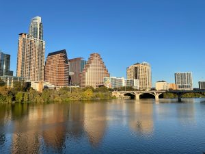 a body of water with buildings in the background -- Photo by Prabhjot Gulati on Unsplash